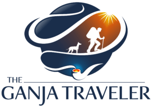 The Ganja Traveler log of backpacker with dog surrounded by smoke emanating from pipe